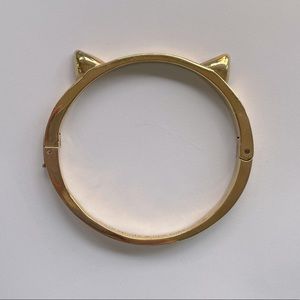 Gold Kate Spade cat ear clasp bangle